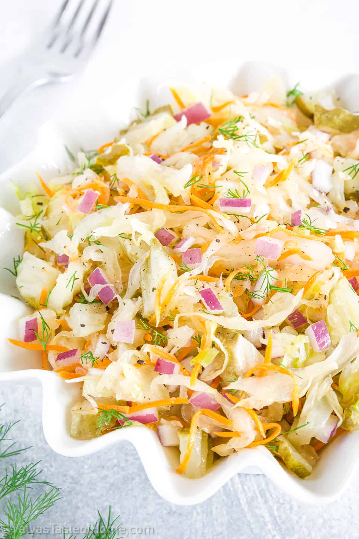 With its combination of homemade sauerkraut, sliced pickles, and chopped red onions, it delivers a delightful crunch in every bite! 