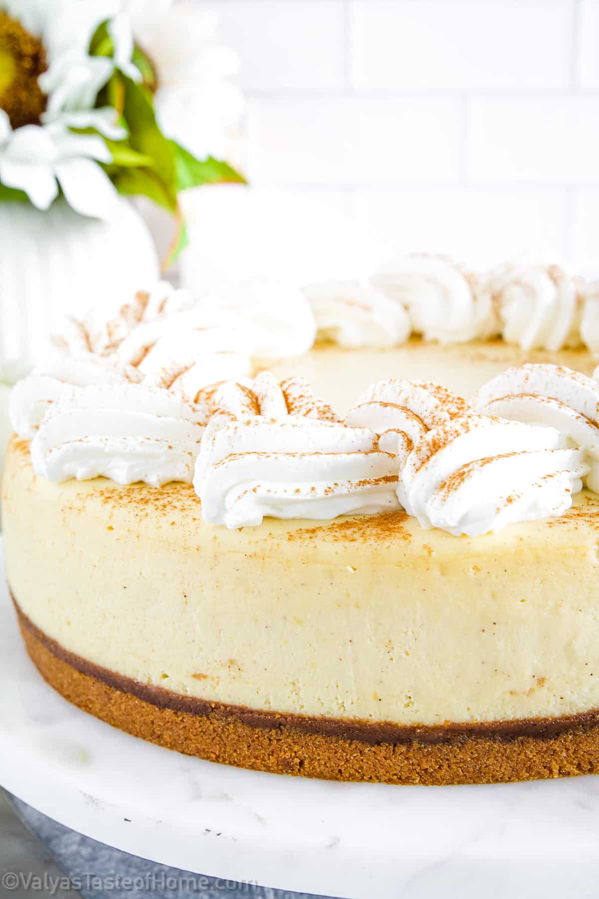 The cheesecake's taste is a delightful balance of sweet and tangy, with the distinct pumpkin flavor shining through.