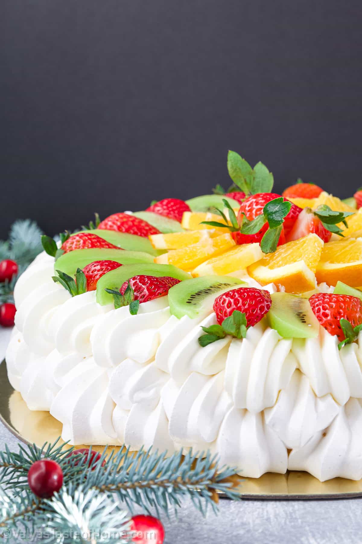 With its delicate meringue base that is crisp on the outside and marshmallow-like on the inside, topped with a luscious layer of whipped cream and an assortment of fresh fruits, this dessert is a true showstopper. 