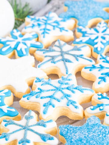 Making snowflake cookies with royal icing at home is a fun activity that can involve the entire family.