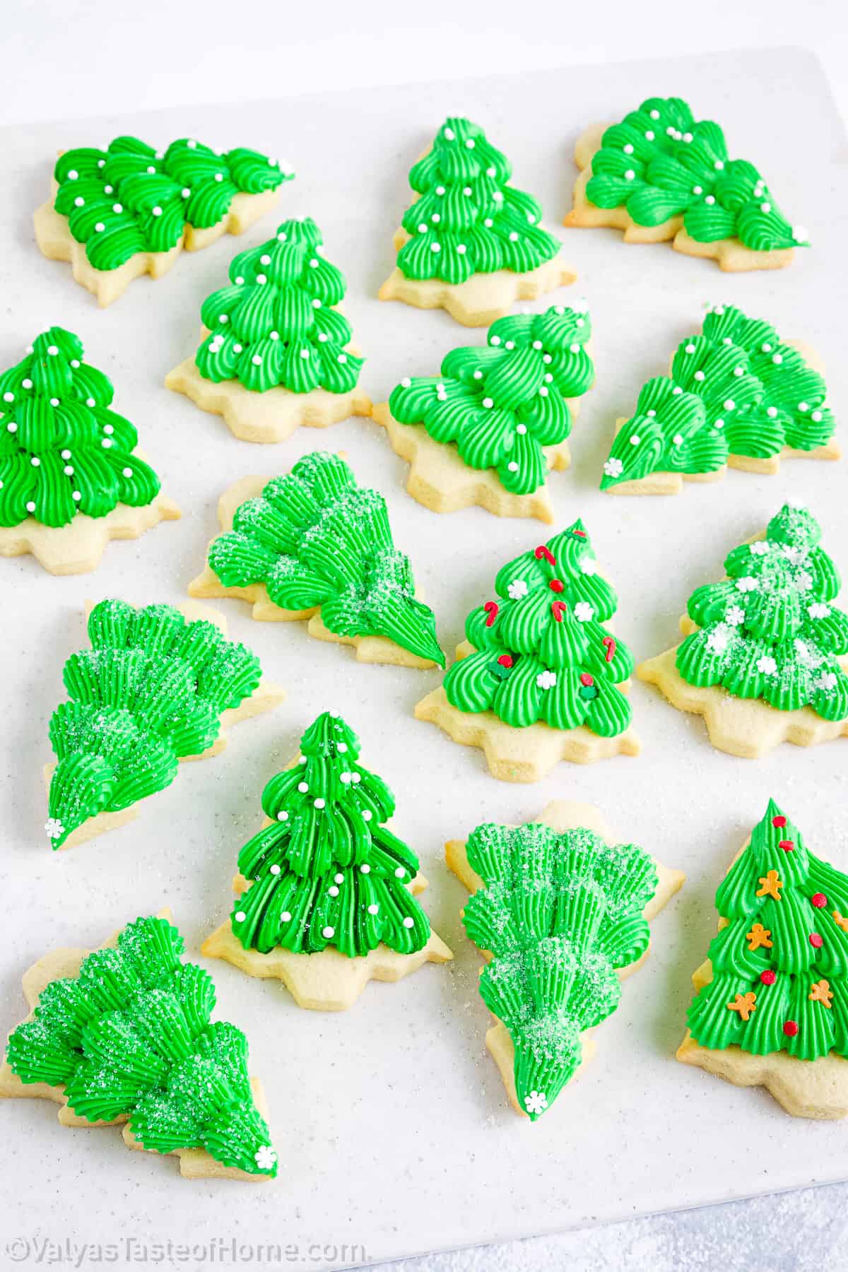 The process of rolling out the dough and using cookie cutters to create Christmas tree shapes is a baking tradition that many people enjoy.