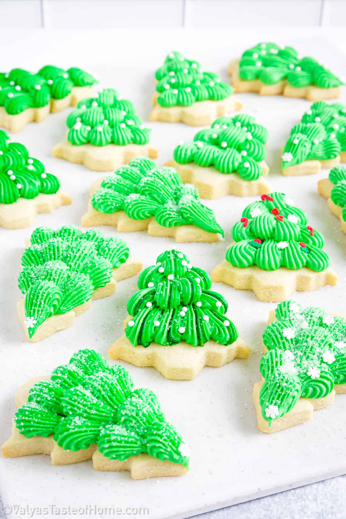 Making these Christmas tree sugar cookies at home is a fun and creative activity. 