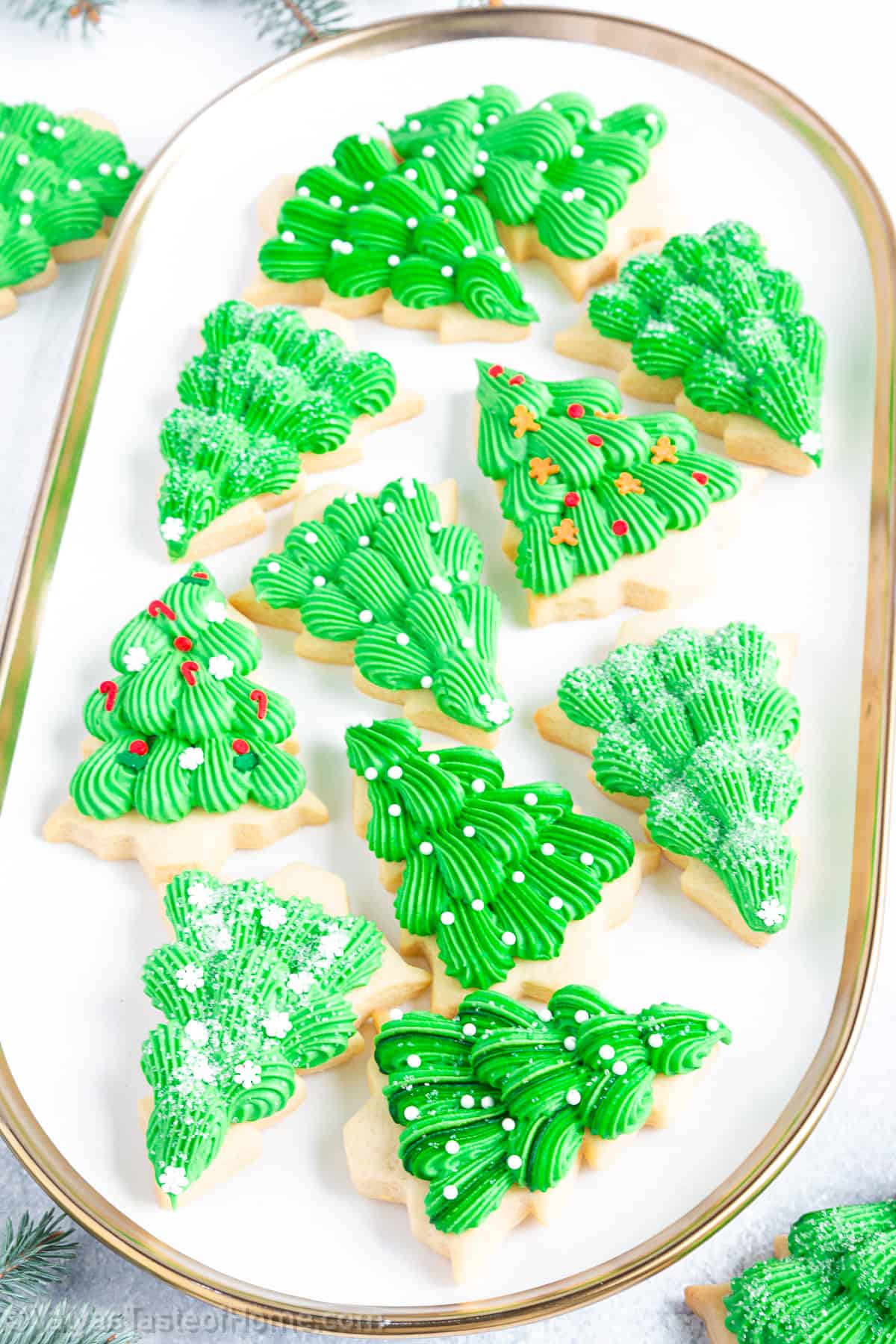 Making these Christmas tree sugar cookies at home is a fun and creative activity.