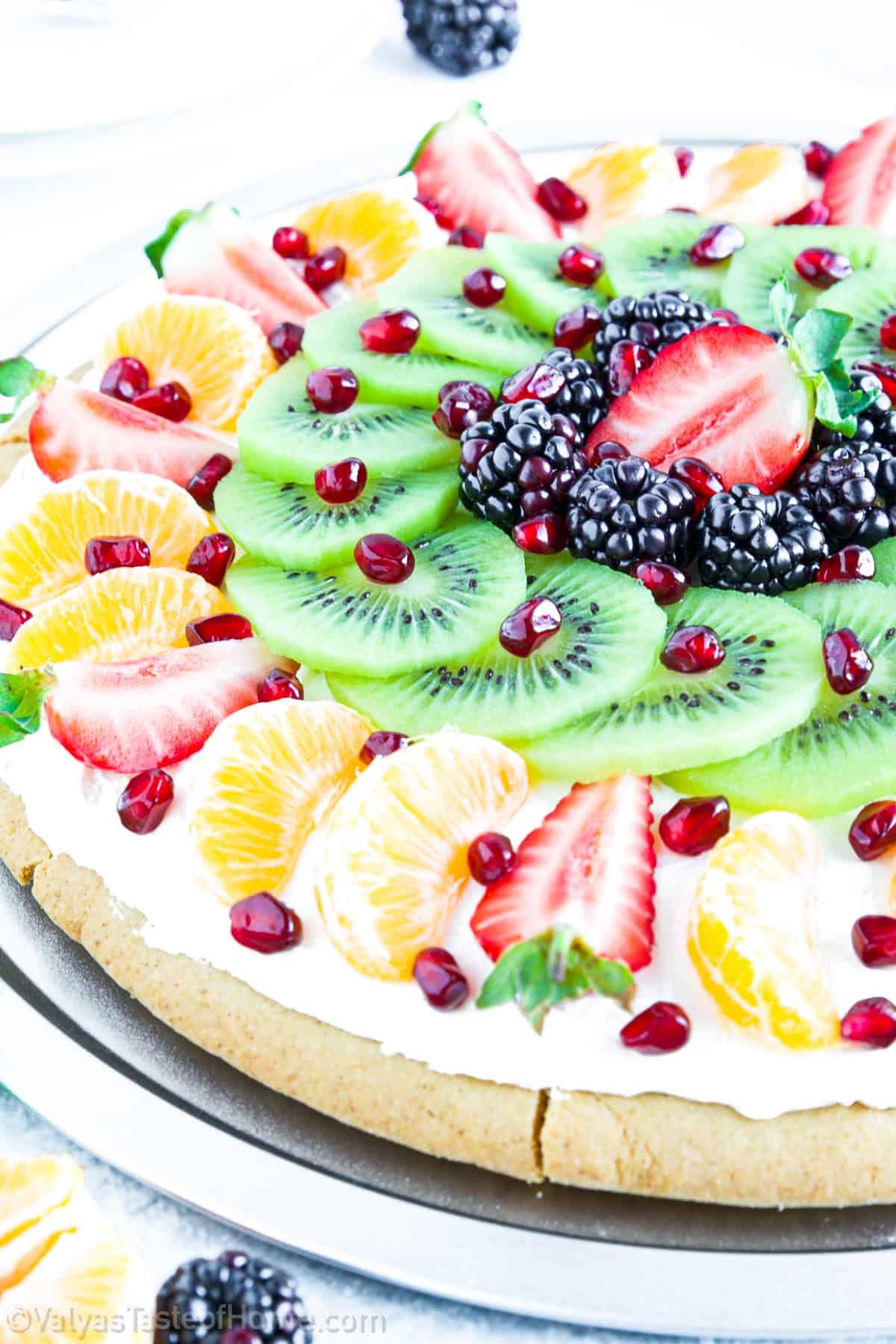 Sugar cookie fruit pizza is a delicious dessert that combines the sweetness of sugar cookies with the fresh, vibrant flavors of fruit. 