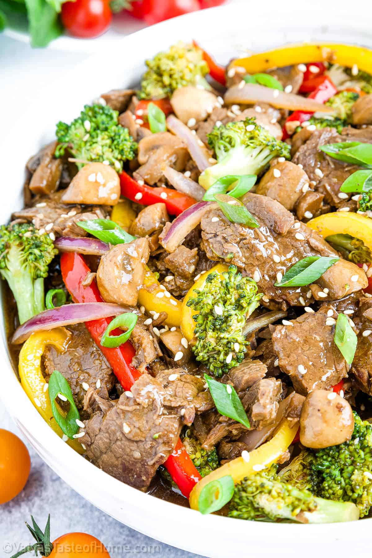 This dish is a real crowd-pleaser, combining juicy beef with a colorful combination of veggies, including red and yellow bell peppers, broccoli florets, red onions, sugar snap peas, and mushrooms.