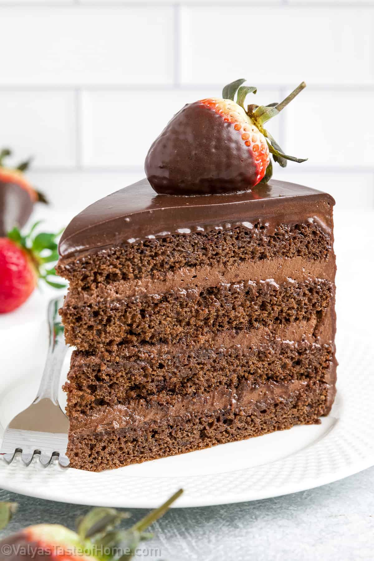 This chocolate layer cake features perfect layers of classic chocolate cake and a rich chocolate frosting.