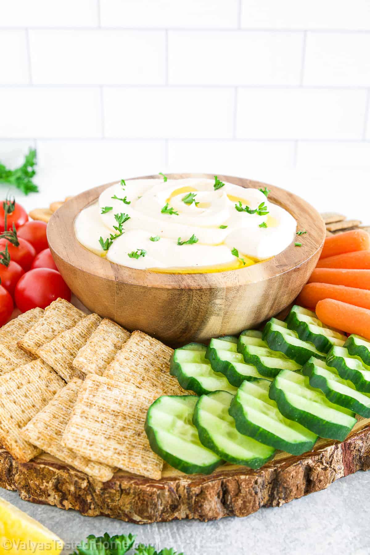This 5-minute Whipped Feta Dip is a game-changer for your party menu. Incredibly versatile, it's a blend of rich feta cheese, tangy Greek yogurt, and a hint of garlic that can be served in so many ways to please a crowd!