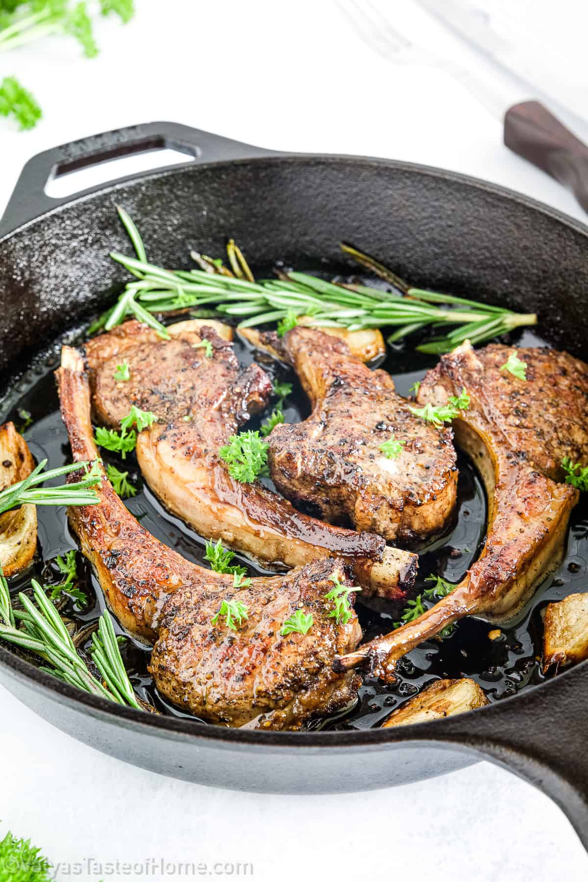 The lion lamb chops are seared to a golden crust and then basted with a rich garlic butter infused with fresh rosemary, which adds a warm, earthy note that perfectly complements the lamb.