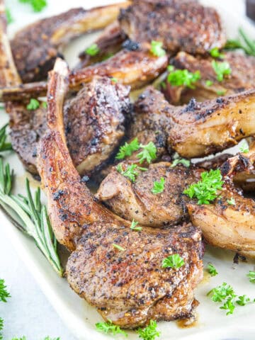 The combination of garlic, butter, and rosemary creates a savory, fragrant sauce that enhances the chops' natural juiciness.