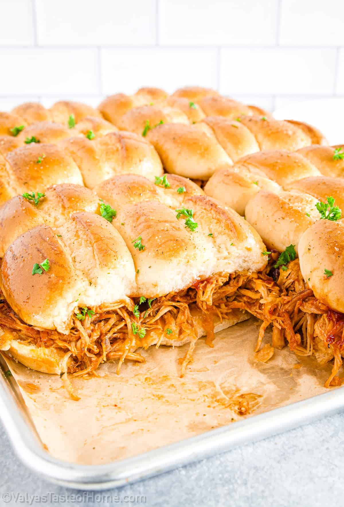 Piled high on soft slider buns and optionally topped with crunchy slaw or melty cheese, they strike the perfect balance of textures and flavors.