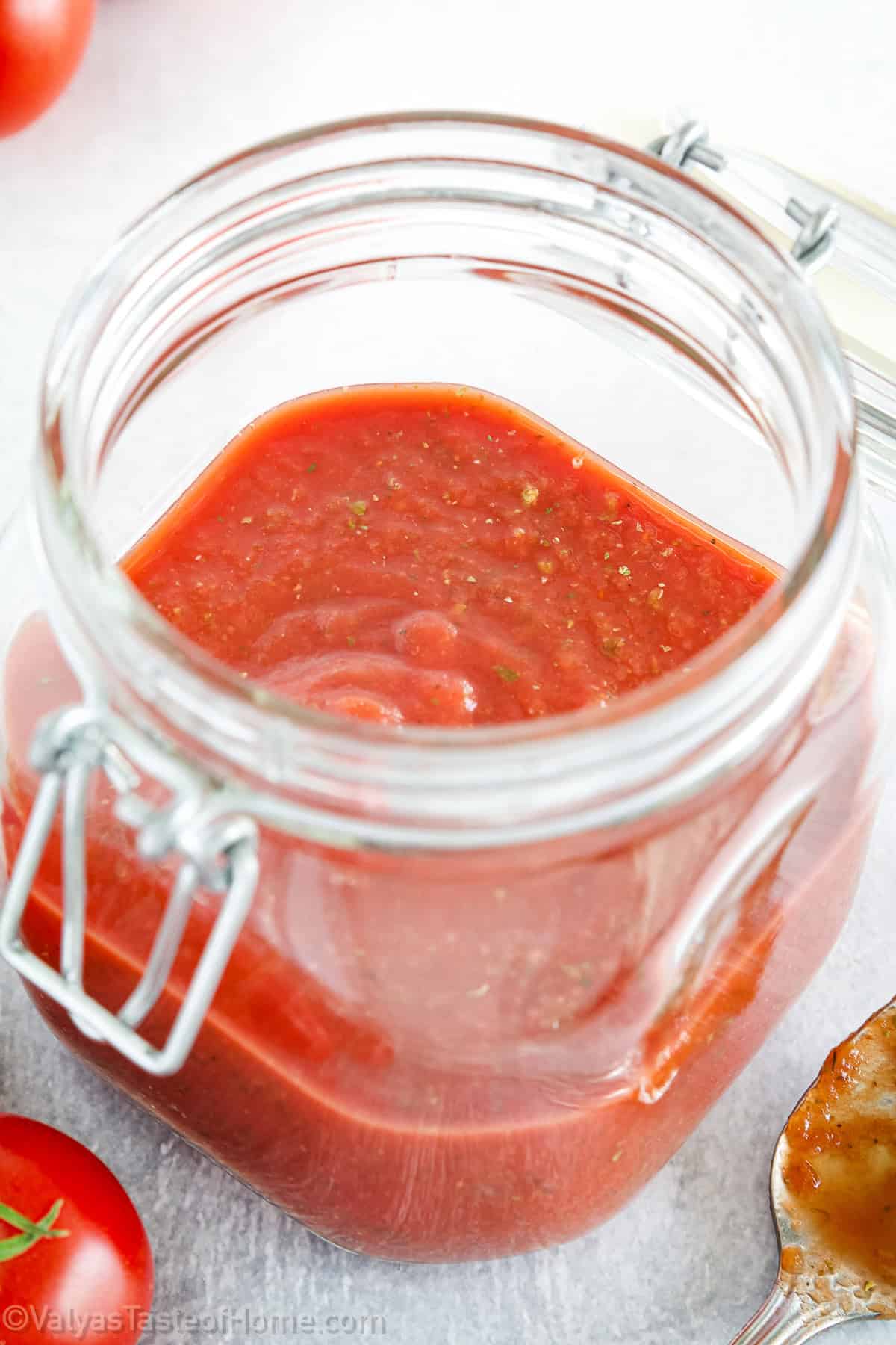 Homemade quick pizza sauce stored in small containers, ready to freeze for future pizza nights.